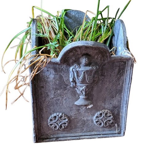 573 - AN 18TH CENTURY STYLE LEAD GARDEN CASTLE 
Top planter of hexagonal form, figured with urn.
(29cm x 2... 