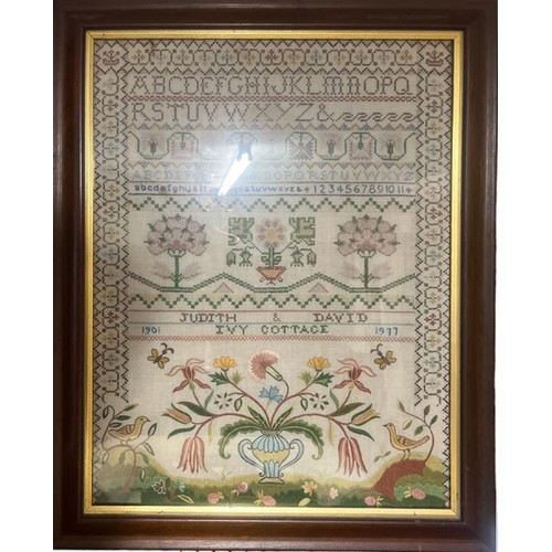 498A - A VICTORIAN NEEDLEWORK SAMPLER, Maude Foot aged 12, 1891 Birdseye maple framed and glazed
along with... 