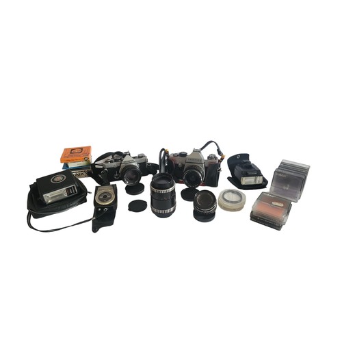 11A - A COLLECTION OF VINTAGE CAMERAS and accessories to include Olympus, Praktika, lenses, etc.