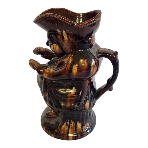 207 - A VICTORIAN STAFFORDSHIRE TOBY JUG
Brown treacle glaze modelled as the Snuff Taker.
(approx 24cm)

C... 