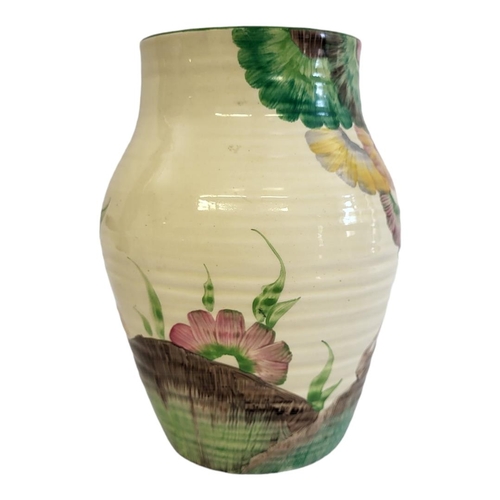 221 - CLARICE CLIFF, BIZARRE RANGE, RHODANTHE PATTERN RIBBED BODY VASE
Polychrome pastel painted with a ba... 