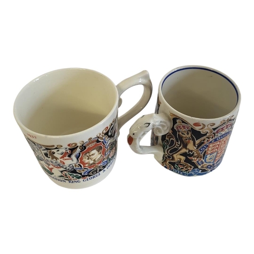 222 - DAME LAURA KNIGHT, R.A., TWO CORONATION MUGS 
Designed and modelled by Dame Knight to commemorate Ed... 