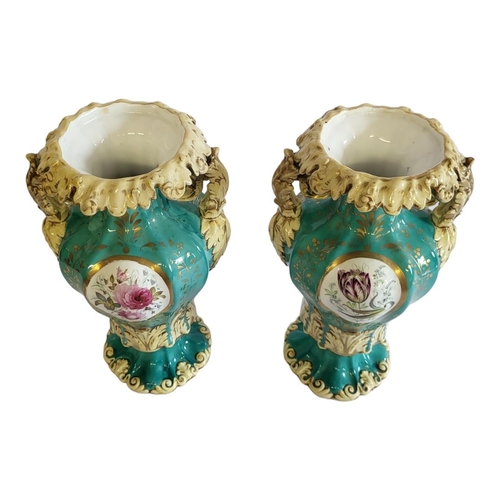 236 - A PAIR OF 19TH CENTURY PORCELAIN VASES
Twin handles with hand painted decoration on green ground.
(a... 