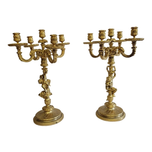 237 - A LARGE PAIR OF 20TH CENTURY GILT BRONZE FIGURAL CANDELABRA
Each having four branch arms, classical ... 