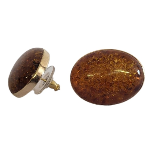 5 - A PAIR OF VINTAGE 9CT GOLD AND AMBER EARRINGS
Set with cabochon cut amber in an oval frame.
(approx ... 