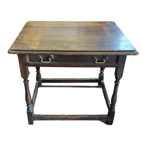 506 - A 19TH CENTURY WILLIAM AND MARY STYLE OAK SIDE TABLE
With single drawer on square and turned legs al... 