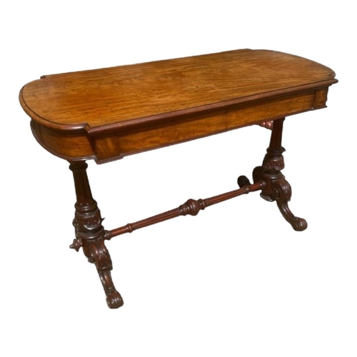 514 - A VICTORIAN MAHOGANY CENTRE TABLE
With two frieze drawers, raised on turned carved columns joined by... 