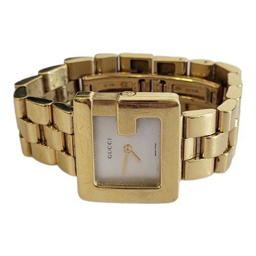 16 - GUCCI, AN 18CT GOLD AND MOTHER OF PEARL 'G' LADIES’ WRISTWATCH
The square form mother of pearl dial ... 