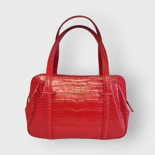 272A - LULU GUINNESS, A MEDIUM RED LEATHER HANDBAG
With croc skin design and monogrammed  interior, complet... 