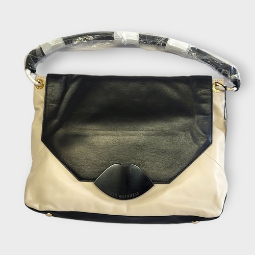 269 - LULU GUINNESS, A MEDIUM LEATHER NICOLA PERSPEX SHOULDER BAG
With black and stone leather, perspex cl... 