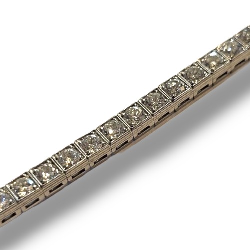 97 - A VINTAGE WHITE METAL AND 4.5CT DIAMOND TENNIS BRACELET
Having a single row of round cut diamonds, i... 