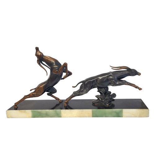 332 - JACQUES LIMOUSIN, AN ART DECO DESIGN COPPER AND ONYX FIGURAL GROUP  SCULPTURE
Titled 'Cervi', two an... 