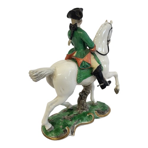 333 - A NYMPHENBURG LATE 19TH/EARLY 20TH CENTURY HARD PASTE PORCELAIN FIGURAL GROUP, PRUSSIAN HUNTER ON HO... 