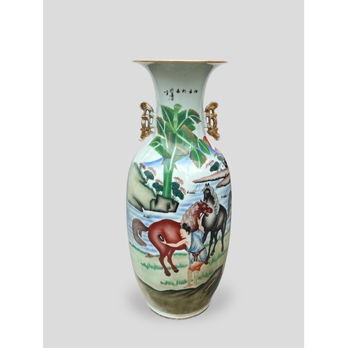 355 - A LARGE ANTIQUE CHINESE EXPORT PORCELAIN VASE 
Decorated with a rural landscape view with horses, po... 