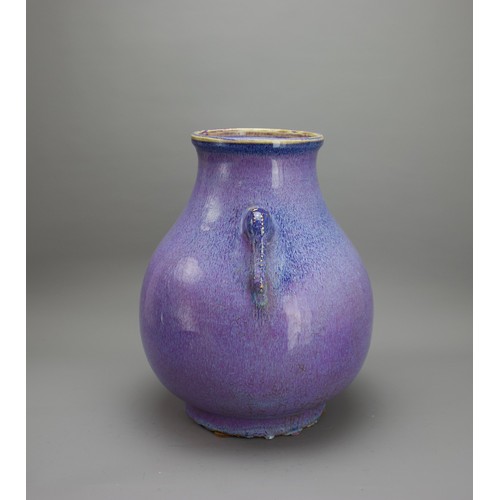 356 - A 20TH CENTURY CHINESE FLAMBE HU TWIN HANDLED VASE
The body applied with good subtle flecked glaze i... 