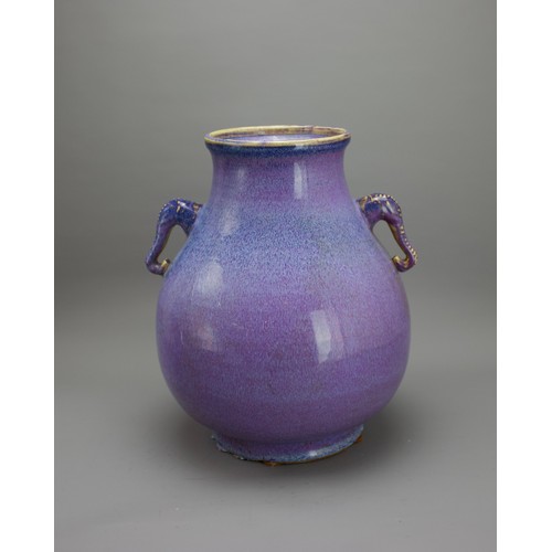 356 - A 20TH CENTURY CHINESE FLAMBE HU TWIN HANDLED VASE
The body applied with good subtle flecked glaze i... 