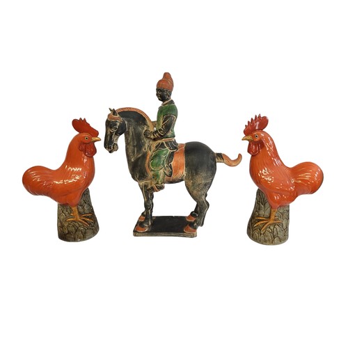 368 - A PAIR OF MID 20TH CENTURY CHINESE HARD PASTE PORCELAIN IRON-RED GLAZED MODELS OF COCKERELS
in Kangx... 