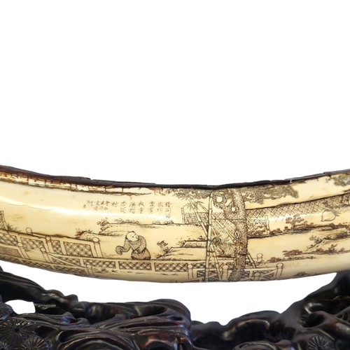 380 - A LARGE CARVED WOOLY MAMMOTH TUSK
Finely figured with numerous elders, officials, scholars, children... 