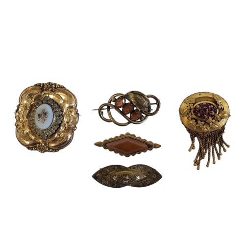 155 - A COLLECTION OF VICTORIAN YELLOW METAL AND PASTE SET BROOCHES
To include an etruscan form brooch wit... 