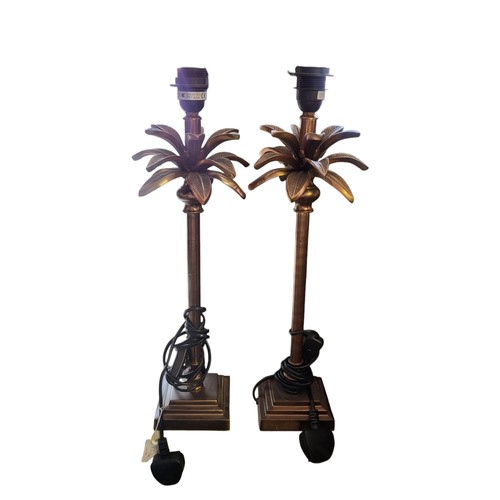 182 - A PAIR OF 20TH CENTURY BRASS AND COLOURED GLASS ELECTRIC LAMPS
Three branches with trumpet form shad... 