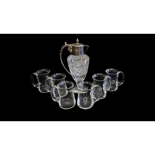 381 - A MID 20TH CENTURY SILVER PLATED MOUNTED CRYSTAL CUT GLASS CLARET JUG 
A set of six moulded glass al... 