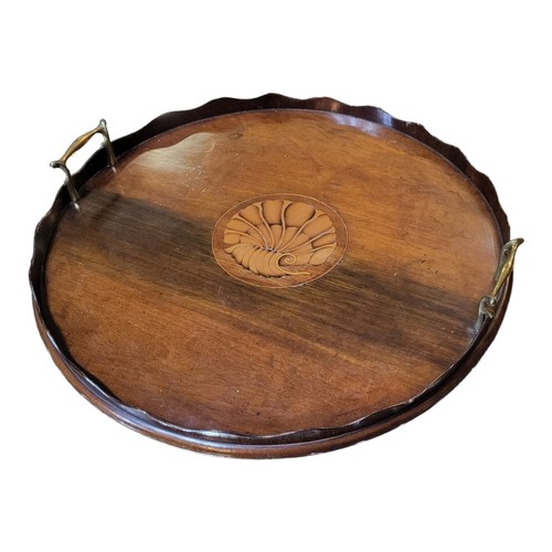 389 - A 19TH CENTURY MAHOGANY BUTLER’S TRAY
Having two brass handles, piecrust gallery edge and inlaid she... 