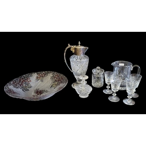 179 - A VINTAGE SILVER PLATE AND CUT GLASS CLARET JUG
Having a single handle and cuts to base, together wi... 