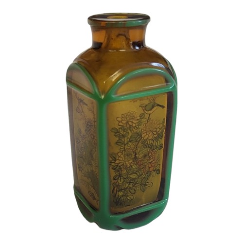 146 - A 19TH CENTURY CHINESE AMBER GLASS SCENT BOTTLE
With internal painted decoration in the form of bird... 