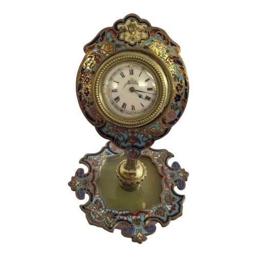 263 - AN EARLY 20TH CENTURY BRASS, ENAMEL AND ONYX TABLE CLOCK
Scrolled case with champleve enamel decorat... 