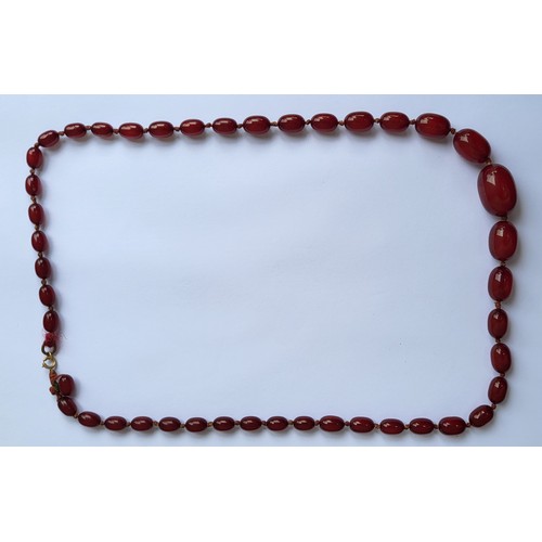 TWO VICTORIAN CHERRY AMBER NECKLACE Having a single strand
