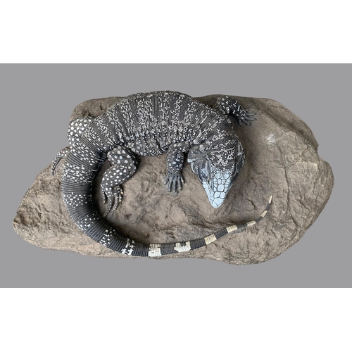 57a - A FINE IMITATION TEGU UPON A NATURALISTIC BASE (TUPINAMBIS).
An extremely rare and realistic hand pa... 