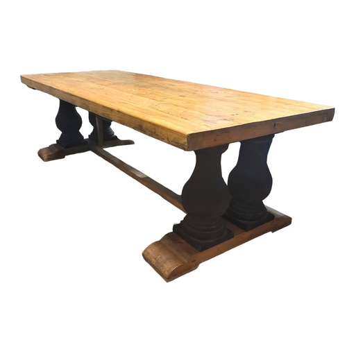 1226 - A LARGE PINE REFECTORY TABLE
The plank top raised on four heavy faux stone balusters standing on ste... 