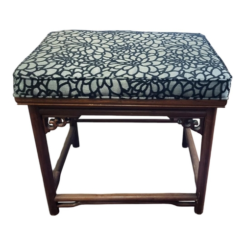 1223 - A CHINESE HARDWOOD STOOL
With upholstered seat above a carved and pierced apron, on turned legs.
(63... 