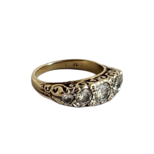 64A - AN EARLY 20TH CENTURY 18CT GOLD AND DIAMOND FIVE STONE RING
The arrangement of graduated round cut d... 