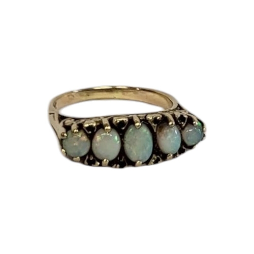 66A - AN EARLY 20TH CENTURY 9CT GOLD OPAL FIVE STONE RING
The row of graduated opals interspersed with dia... 