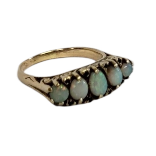 66A - AN EARLY 20TH CENTURY 9CT GOLD OPAL FIVE STONE RING
The row of graduated opals interspersed with dia... 