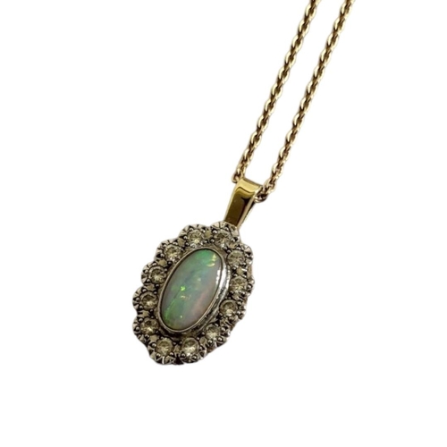 82A - AN 18CT GOLD, OPAL AND DIAMOND PENDANT NECKLACE
The cabochon cut opal edged with round cut diamonds ... 