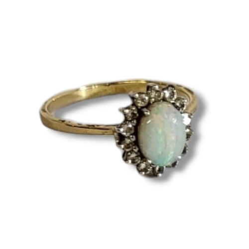 62A - AN 18CT GOLD, OPAL AND DIAMOND RING
The central cabochon cut opal,edged with round cut diamonds, in ... 