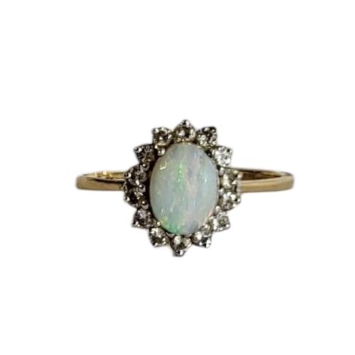 62A - AN 18CT GOLD, OPAL AND DIAMOND RING
The central cabochon cut opal,edged with round cut diamonds, in ... 