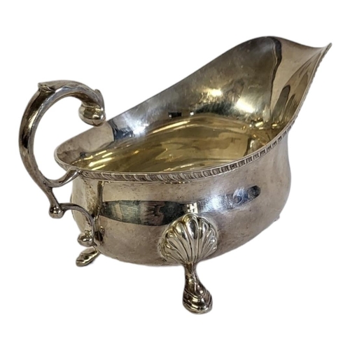 92A - AN EARLY 20TH CENTURY SILVER SAUCE BOAT
Having a single handle with shell firm tripod legs, hallmark... 