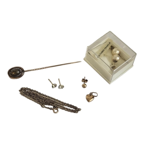 74A - A COLLECTION OF VINTAGE YELLOW METAL JEWELLERY
To include a stickpin with pierced decoration, a fine... 