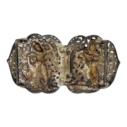 77A - AN EARLY 20TH CENTURY INDIAN SILVER NURSES BUCKLE
Having embossed figures and pierced decoration
(ap... 