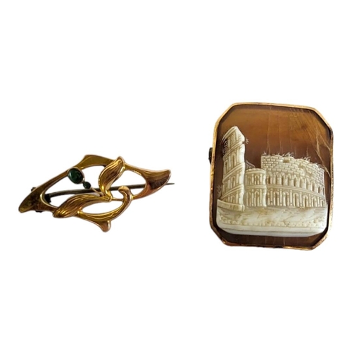 63A - A 19TH CENTURY CONTINENTAL YELLOW METAL CAMEO BROOCH
Carved with classical ruins of The Colosseum, t... 