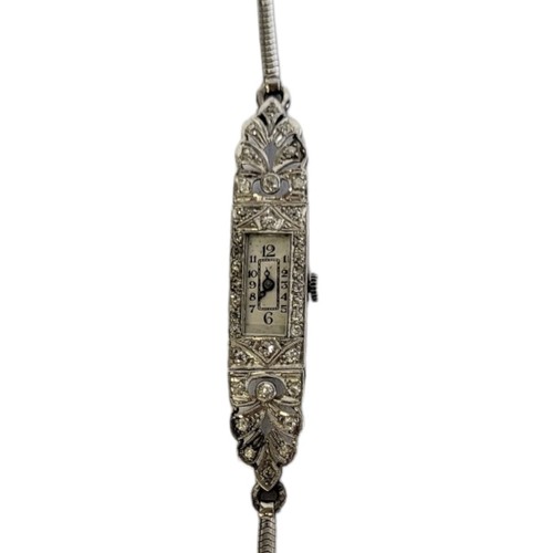 72A - AN ART DECO DECO, PLATINUM AND DIAMOND LADIES’ COCKTAIL WATCH
Rectangular form with pierced case set... 