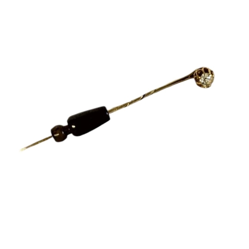 70A - A LATE 19TH/EARLY 20TH CENTURY 15CT GOLD AND DIAMOND STICK/TIEPIN
The single round cut diamond in a ... 