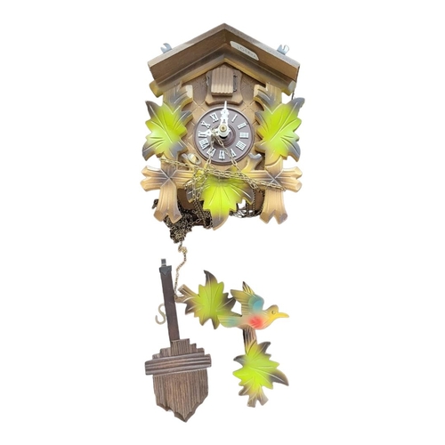 13 - A LATE 19TH SWISS PINE CASED 30 HOUR CUCKOO CLOCK
With weights and pendulum, along with a smaller la... 