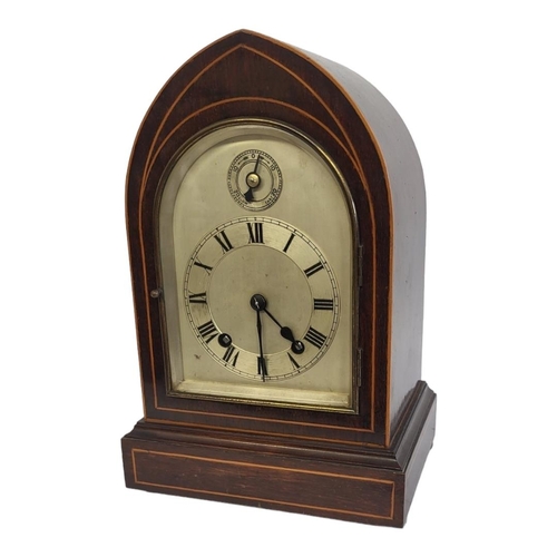 2A - A LATE 19TH CENTURY GOTHIC MAHOGANY AND BOXWOOD INLAID CLOCK
With silvered dial and chiming movement... 