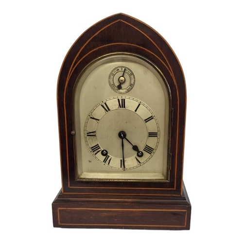 2A - A LATE 19TH CENTURY GOTHIC MAHOGANY AND BOXWOOD INLAID CLOCK
With silvered dial and chiming movement... 