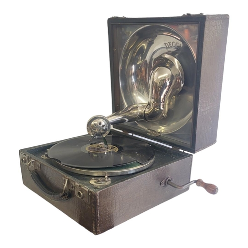 142 - A 1920’S DECCA PORTABLE GRAMOPHONE 
Made in England, chrome plated interior, Decca horn needles comp... 