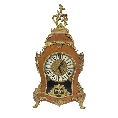 2 - LAURIS, A 20TH CENTURY WALNUT AND GILT BRASS BRACKET CLOCK
Having a pierced brass scrolled finial an... 